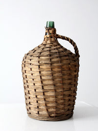 vintage demijohn with basket casing
