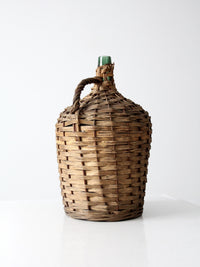 vintage demijohn with basket casing