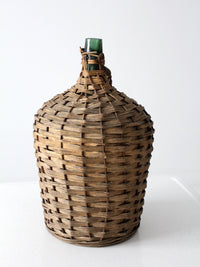 vintage demijohn with basket casing