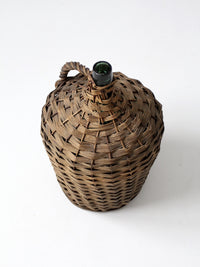 vintage demijohn with basket casing