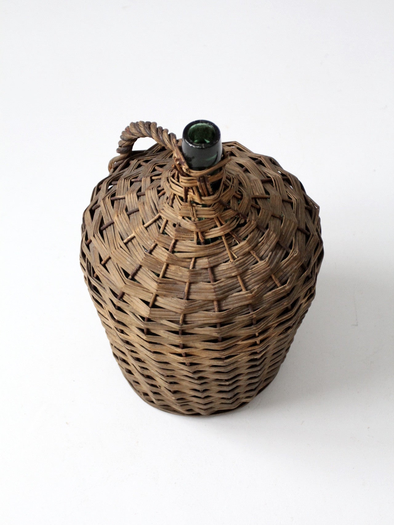 vintage demijohn with basket casing