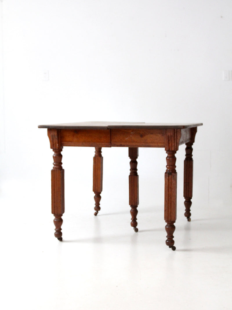 antique five leg dining table