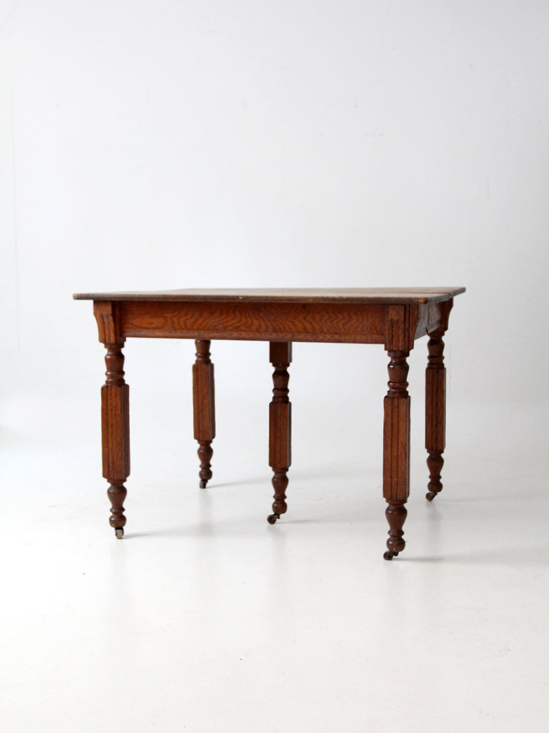 antique five leg dining table