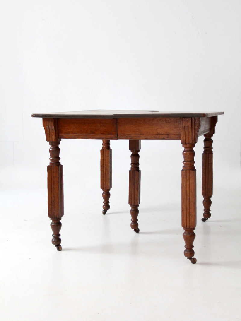 antique five leg dining table