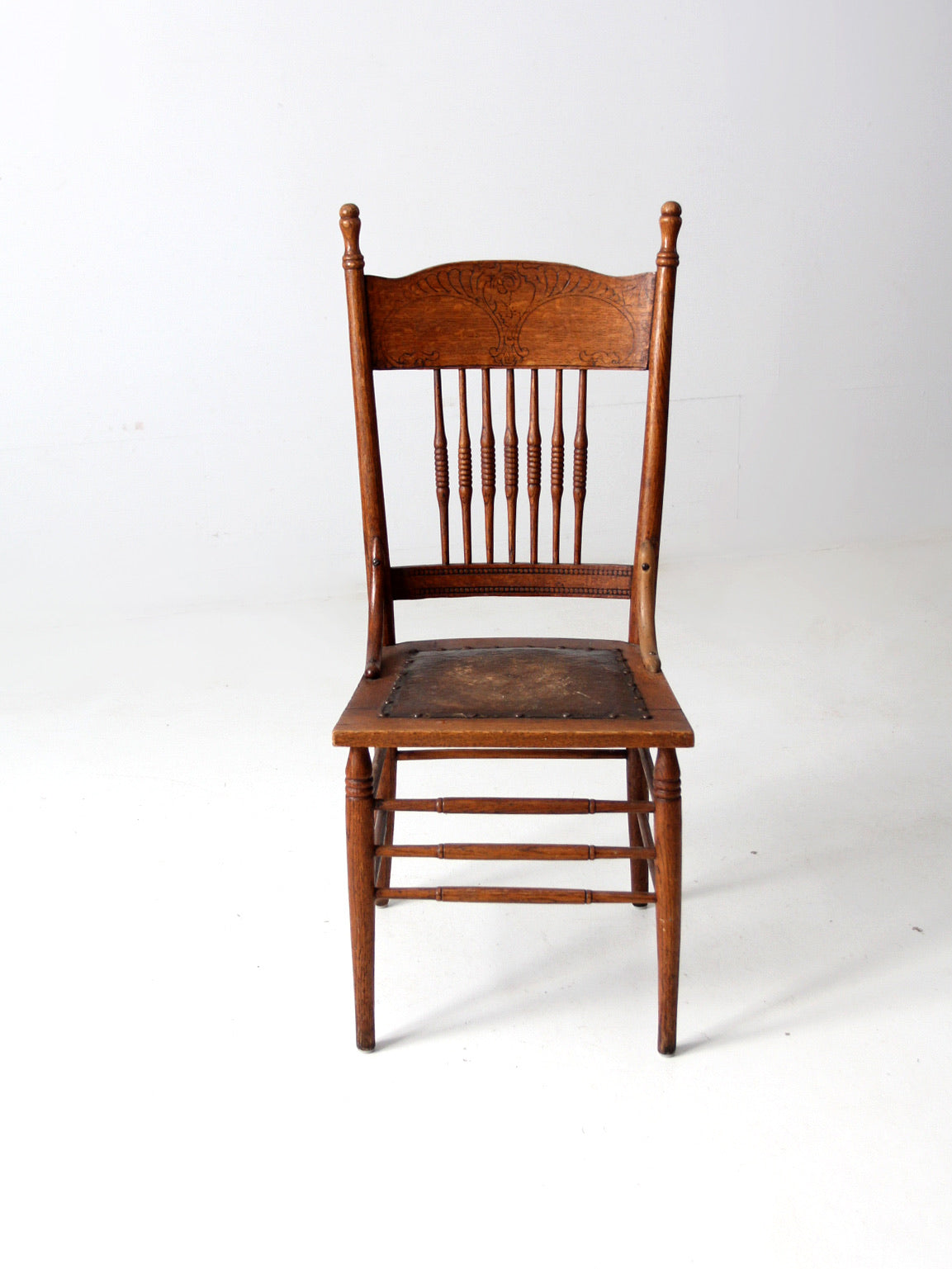 antique pressed back chair with leather seat