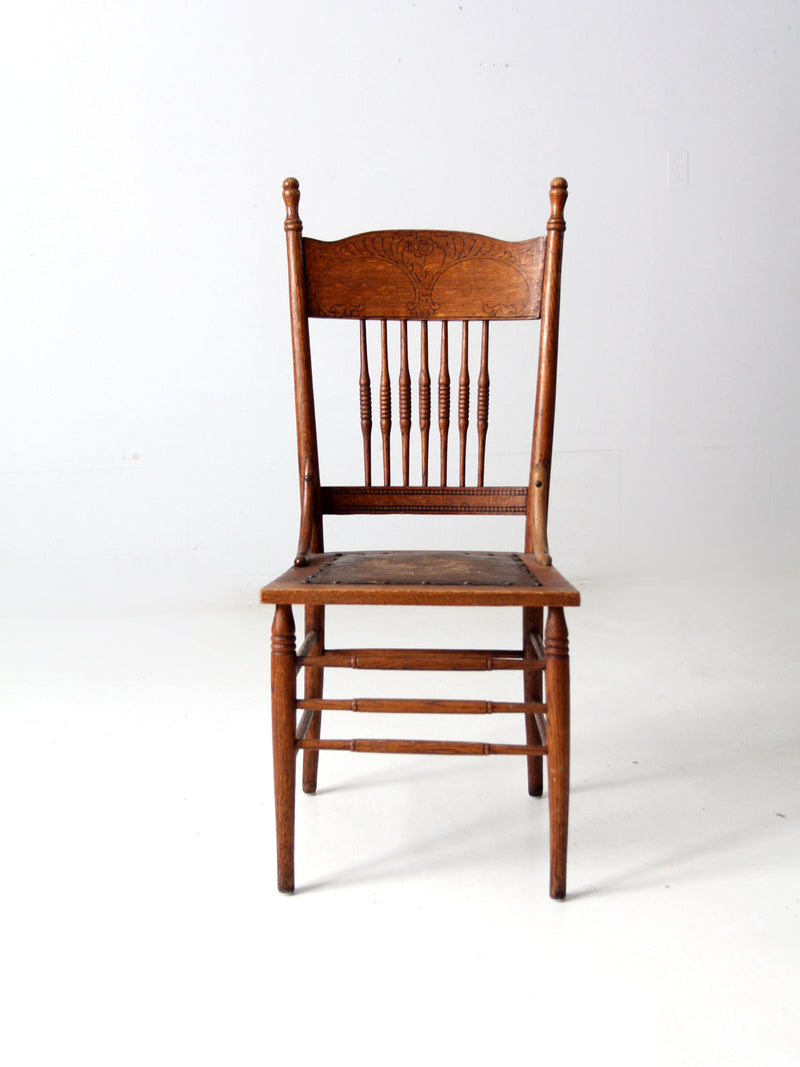 antique pressed back chair with leather seat