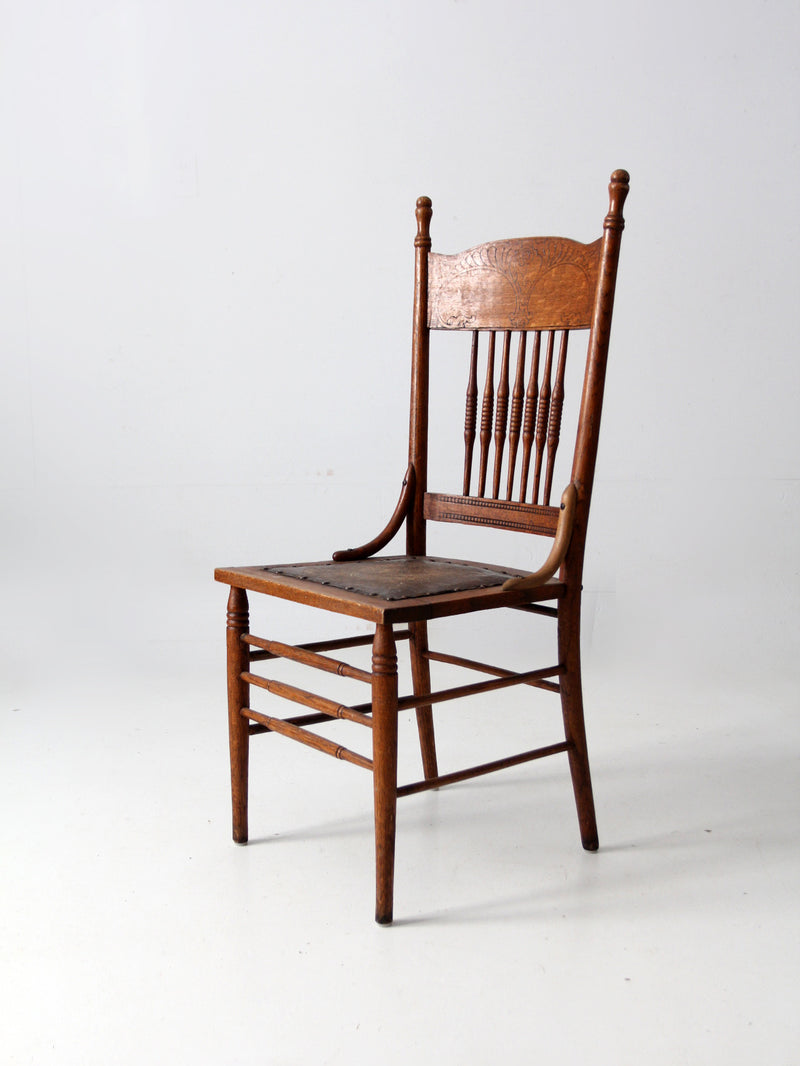 antique pressed back chair with leather seat