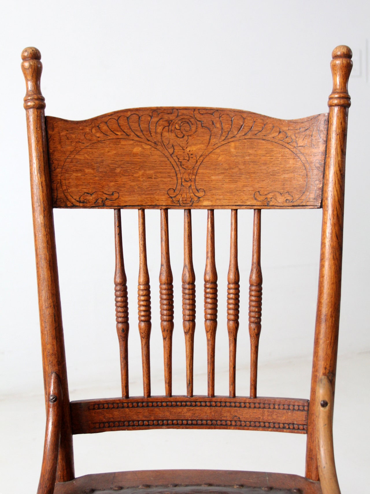 antique pressed back chair with leather seat