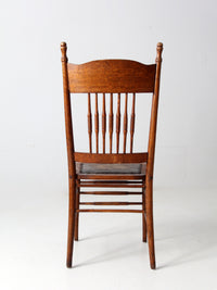 antique pressed back chair with leather seat