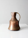 antique hammered copper pitcher