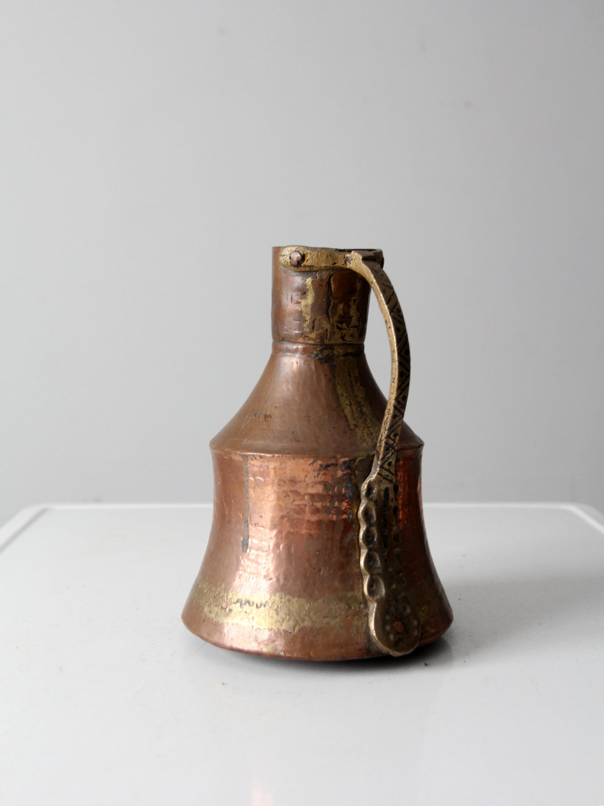antique hammered copper pitcher