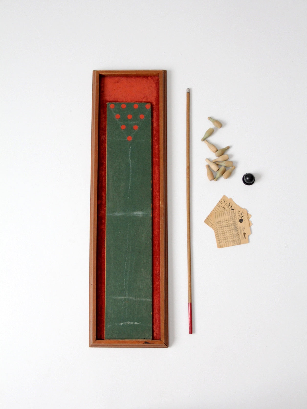 vintage tabletop bowling game with cue stick