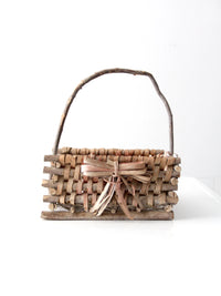 vintage Adirondack style twig basket with bow