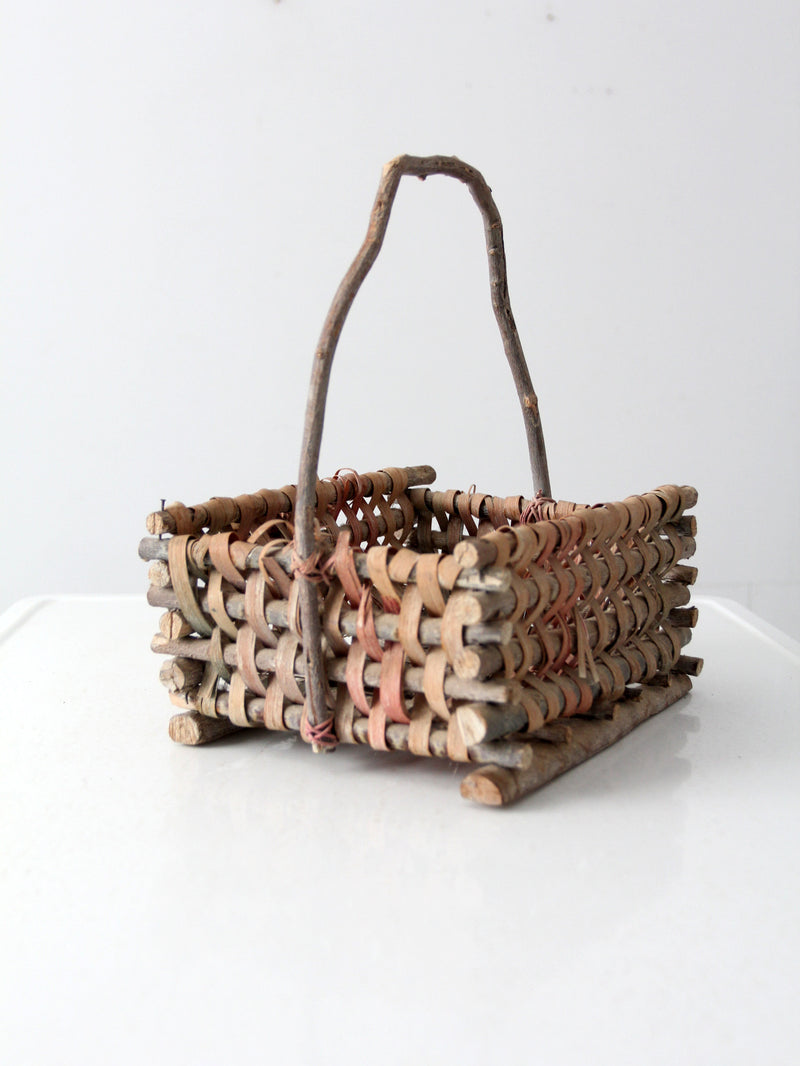 vintage Adirondack style twig basket with bow