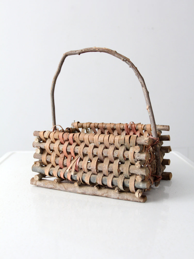 vintage Adirondack style twig basket with bow