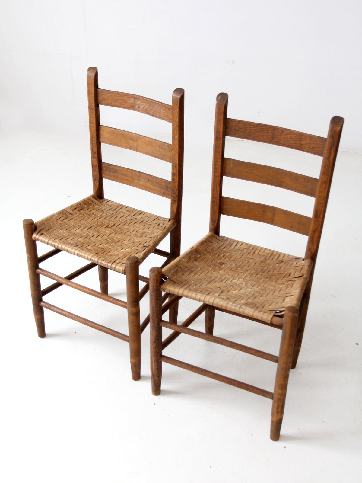 antique splint weave chair pair