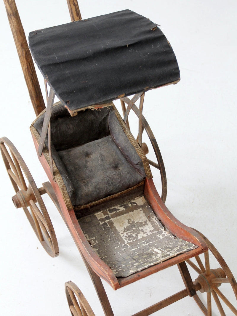 Victorian doll carriage with canopy