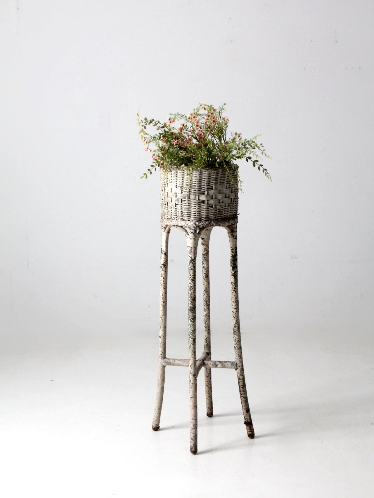 white woven planter antique Victorian tall white wicker planter