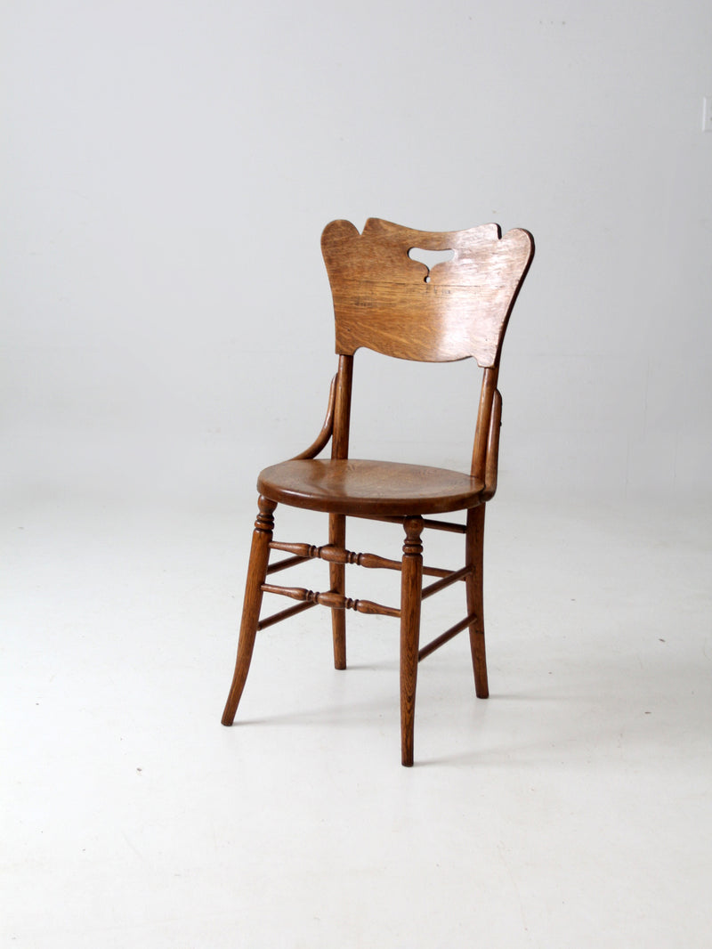 antique bentwood chair with cutout back