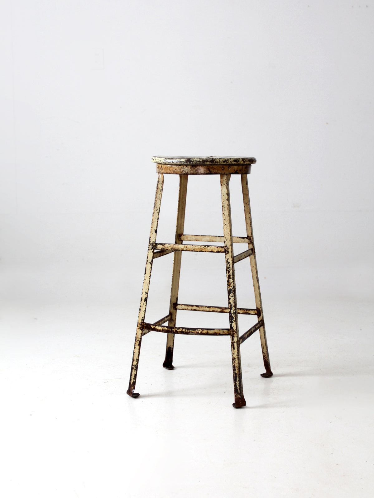 vintage industrial stool with wood seat