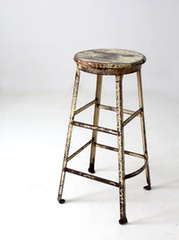 vintage industrial stool with wood seat