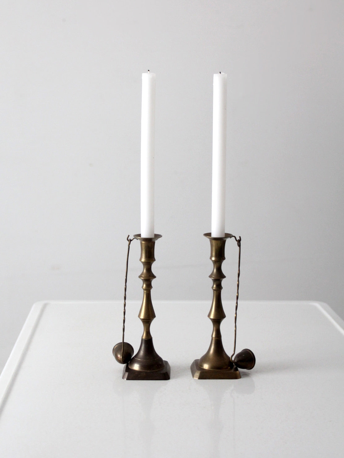antique brass candlestick holders pair with hanging snuffers