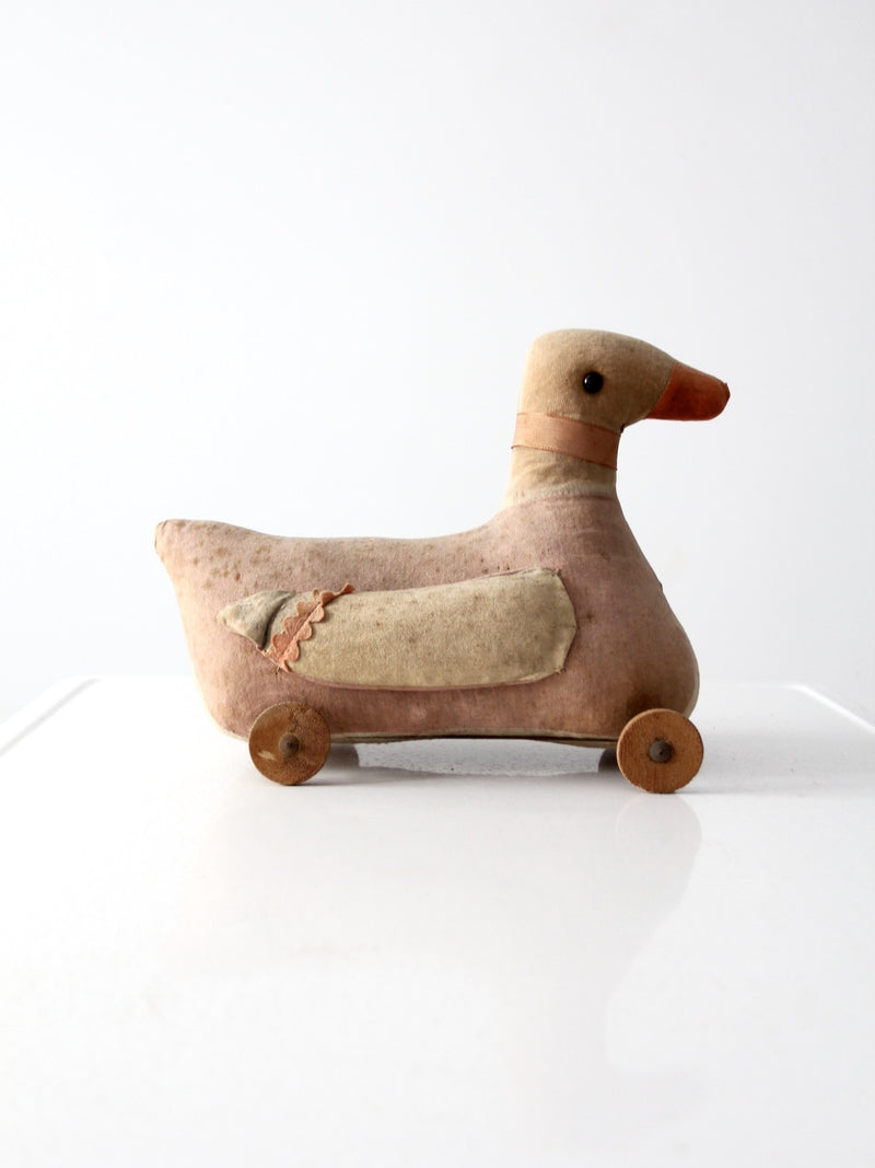 antique toy duck on wheels