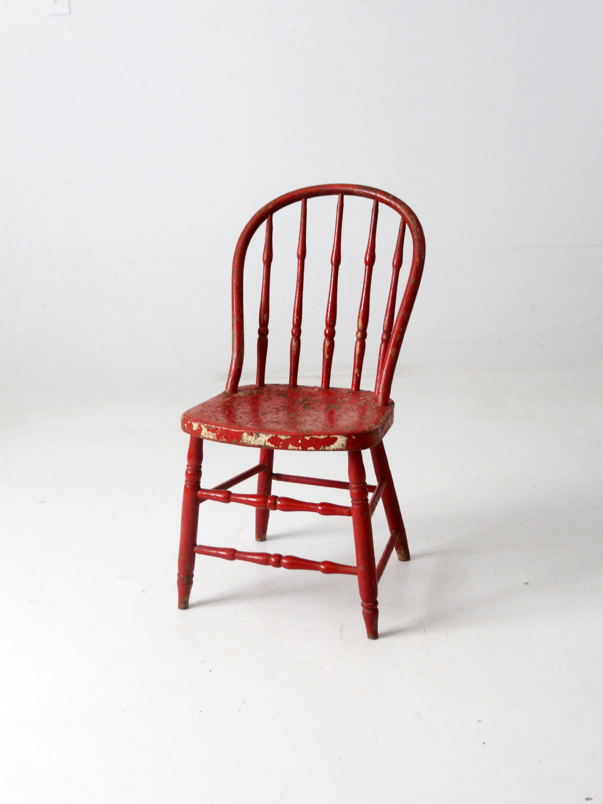 antique red spindle back chair