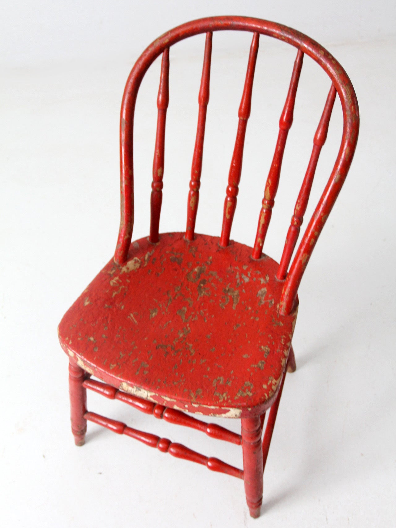 antique red spindle back chair
