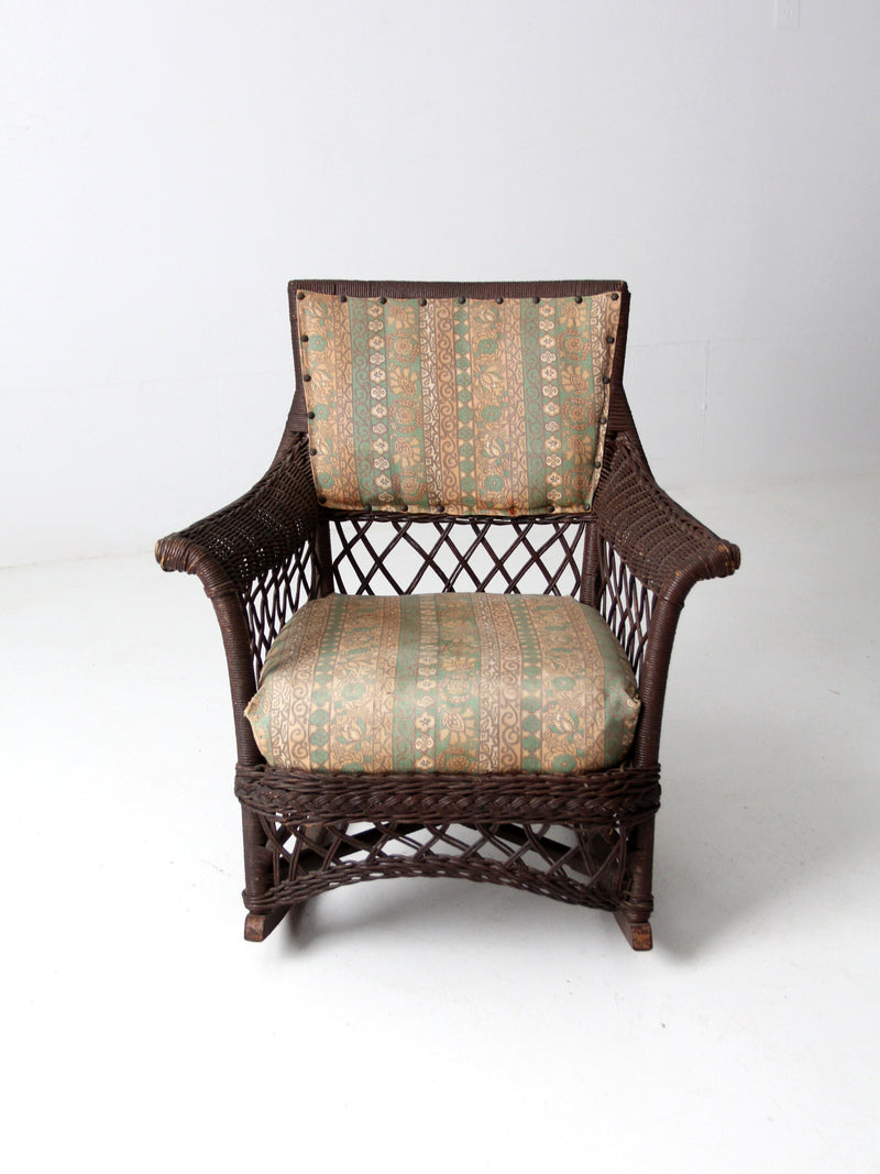 antique wicker rocking chair with cushion seat