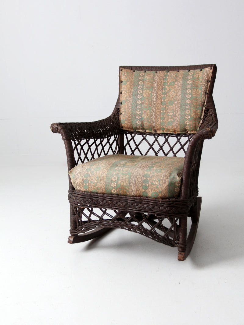 antique wicker rocking chair with cushion seat