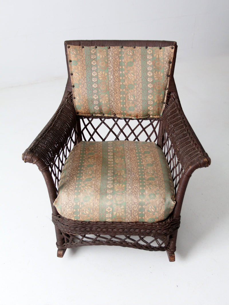 antique wicker rocking chair with cushion seat