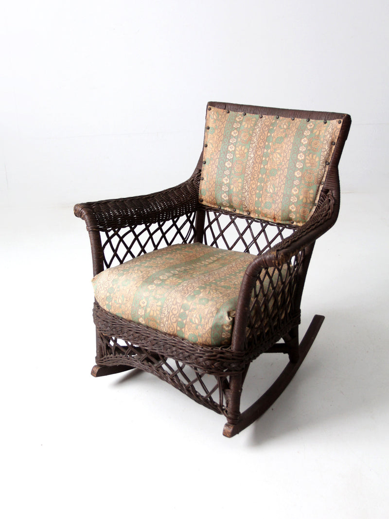 antique wicker rocking chair with cushion seat