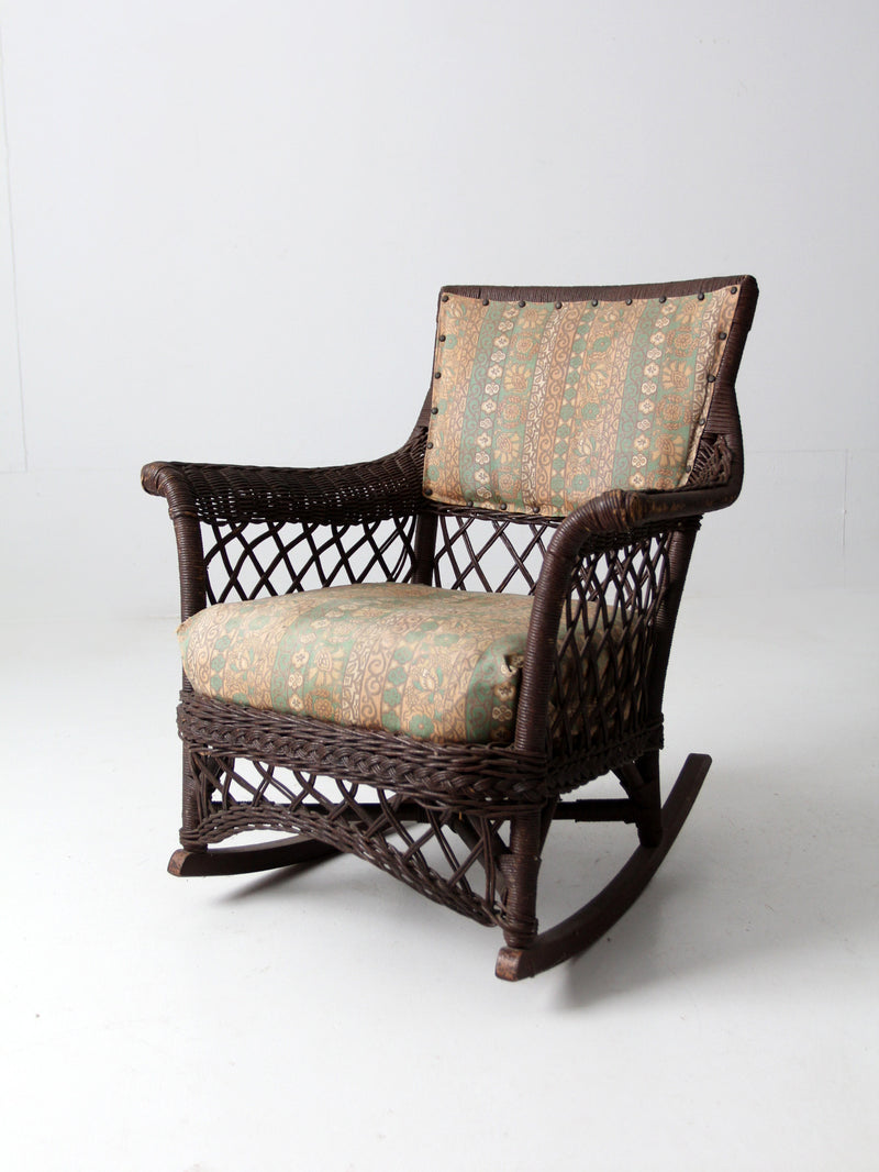 antique wicker rocking chair with cushion seat