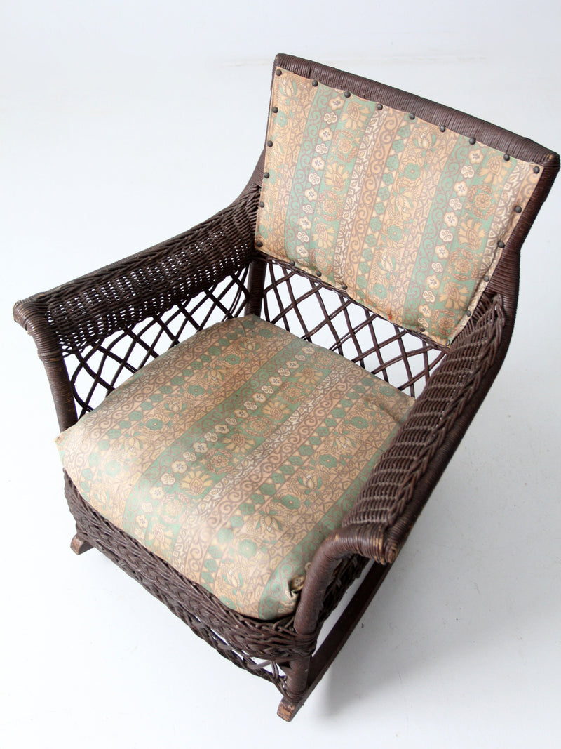 antique wicker rocking chair with cushion seat