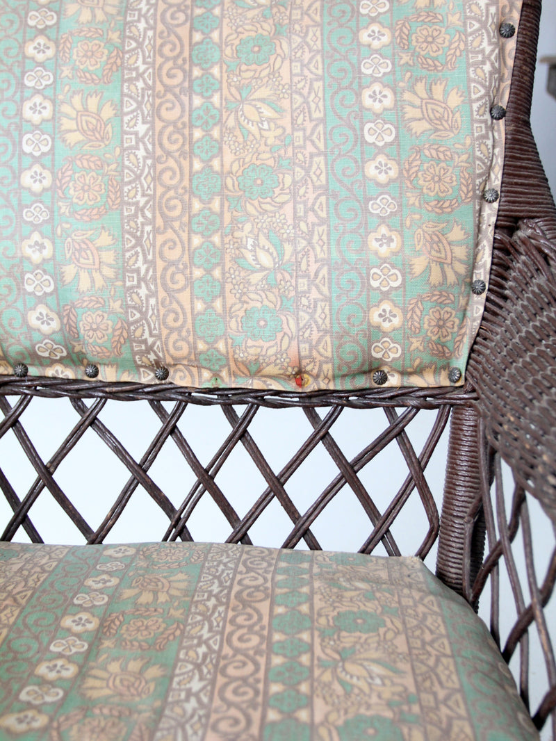 antique wicker rocking chair with cushion seat