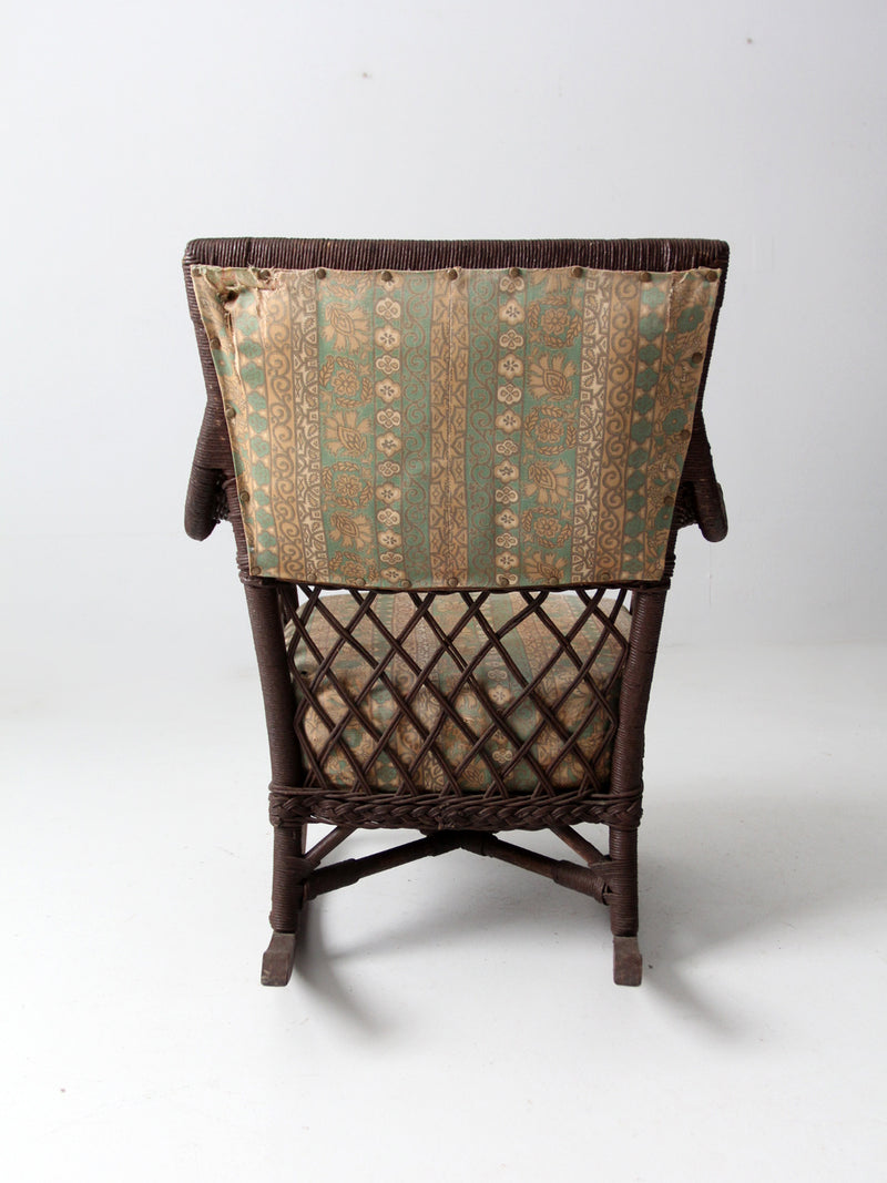 antique wicker rocking chair with cushion seat