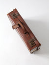 antique leather suitcase with travel stickers