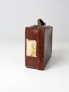 antique leather suitcase with travel stickers