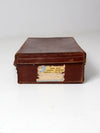 antique leather suitcase with travel stickers