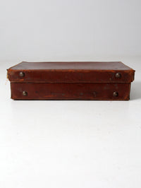 antique leather suitcase with travel stickers