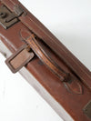 antique leather suitcase with travel stickers