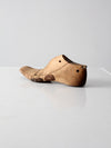 antique cobbler's shoe form with leather patching