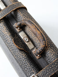 black leather suitcase circa 1930