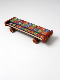 vintage Halsam toy cart with wooden blocks