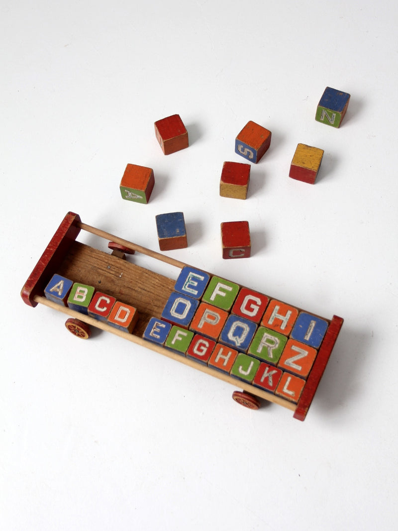 vintage Halsam toy cart with wooden blocks