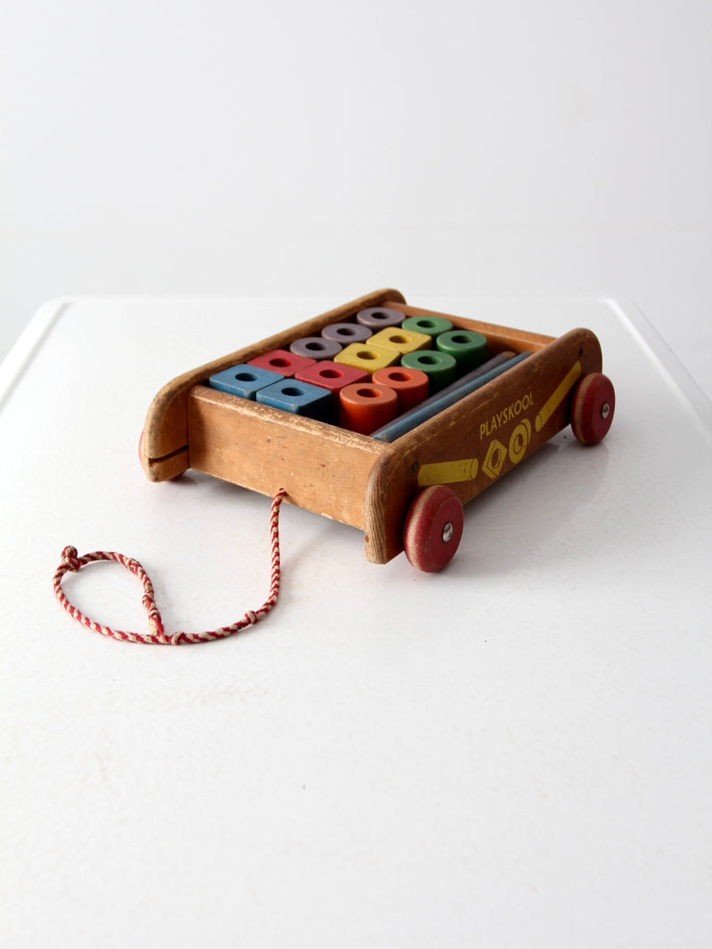 vintage Playskool wagon with wooden toy blocks