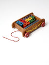 vintage Playskool wagon with wooden toy blocks