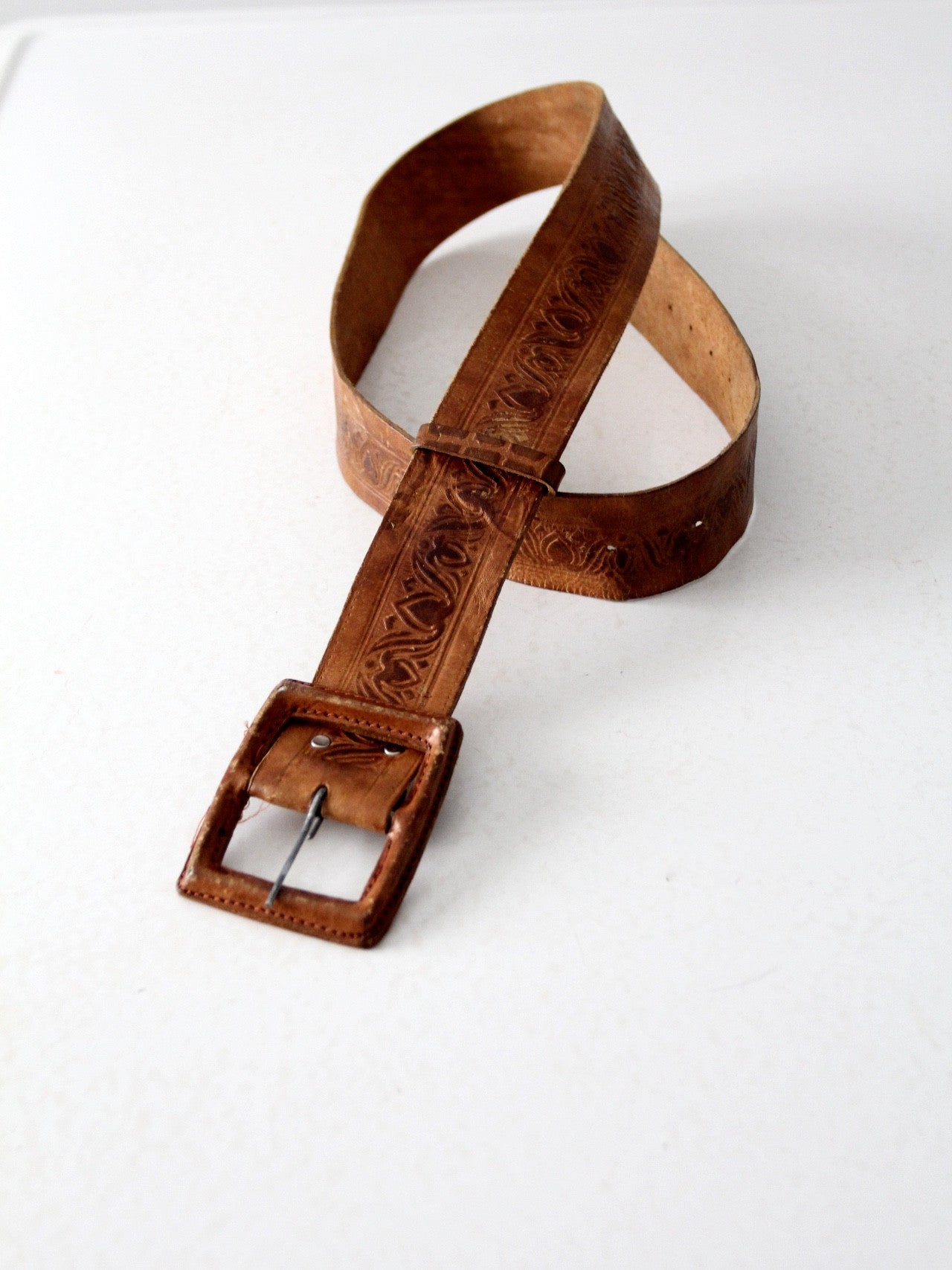 vintage tooled leather belt with leather covered buckle
