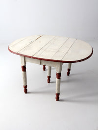 antique drop leaf five leg table